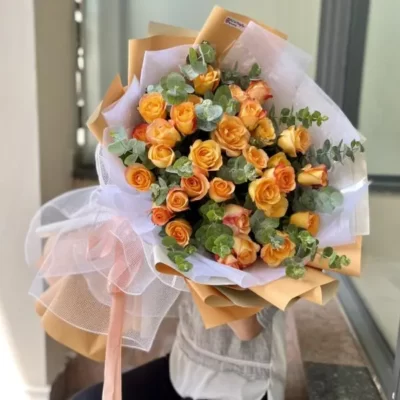 Bó hoa hồng cam mix lá bạc tặng chúc mừng 8/3 ý nghĩa